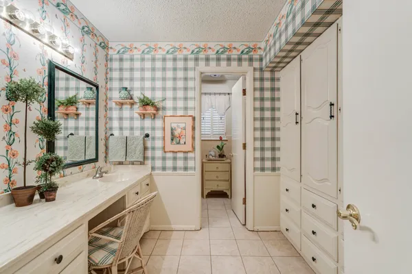 a spacious bathroom with a shower and a sink