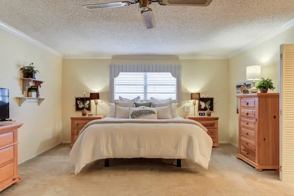 a bedroom with a bed and a dresser