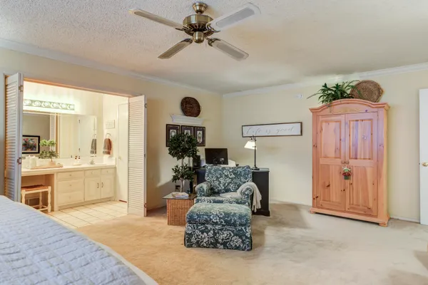a living room with furniture windows and a chandelier
