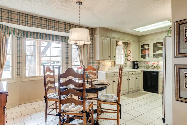 a view of a dining room with furniture window and outside view