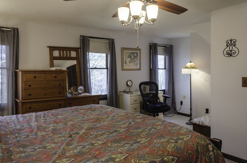 45 Sarah Sherman Road Rochester, MA 02770 - Photo 11 of 25 a bedroom with a bed and a chandelier