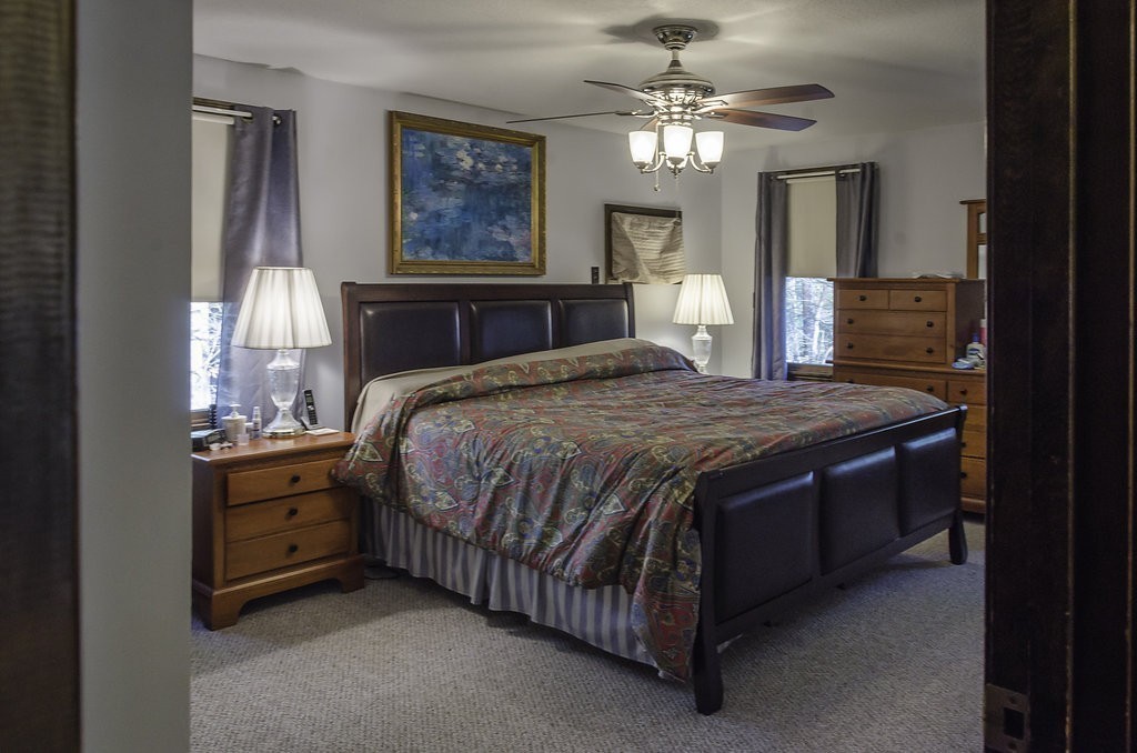 45 Sarah Sherman Road Rochester, MA 02770 - Photo 12 of 25 a bedroom with a bed and a chandelier