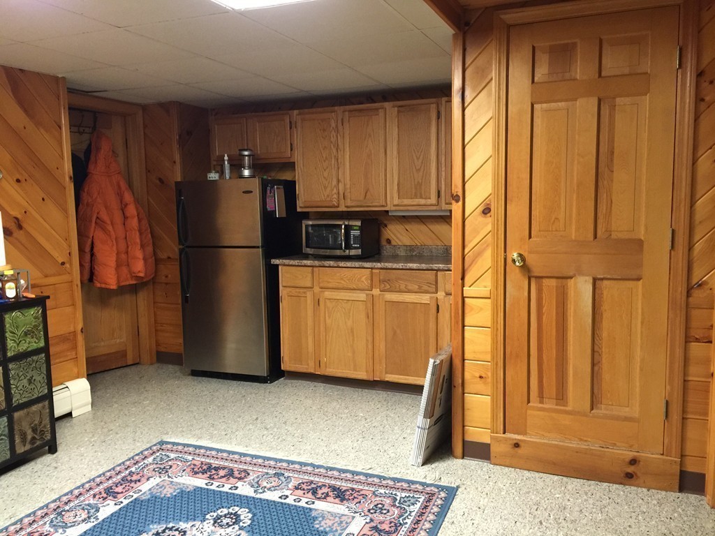 45 Sarah Sherman Road Rochester, MA 02770 - Photo 18 of 25 a kitchen with stainless steel appliances a refrigerator and a stove