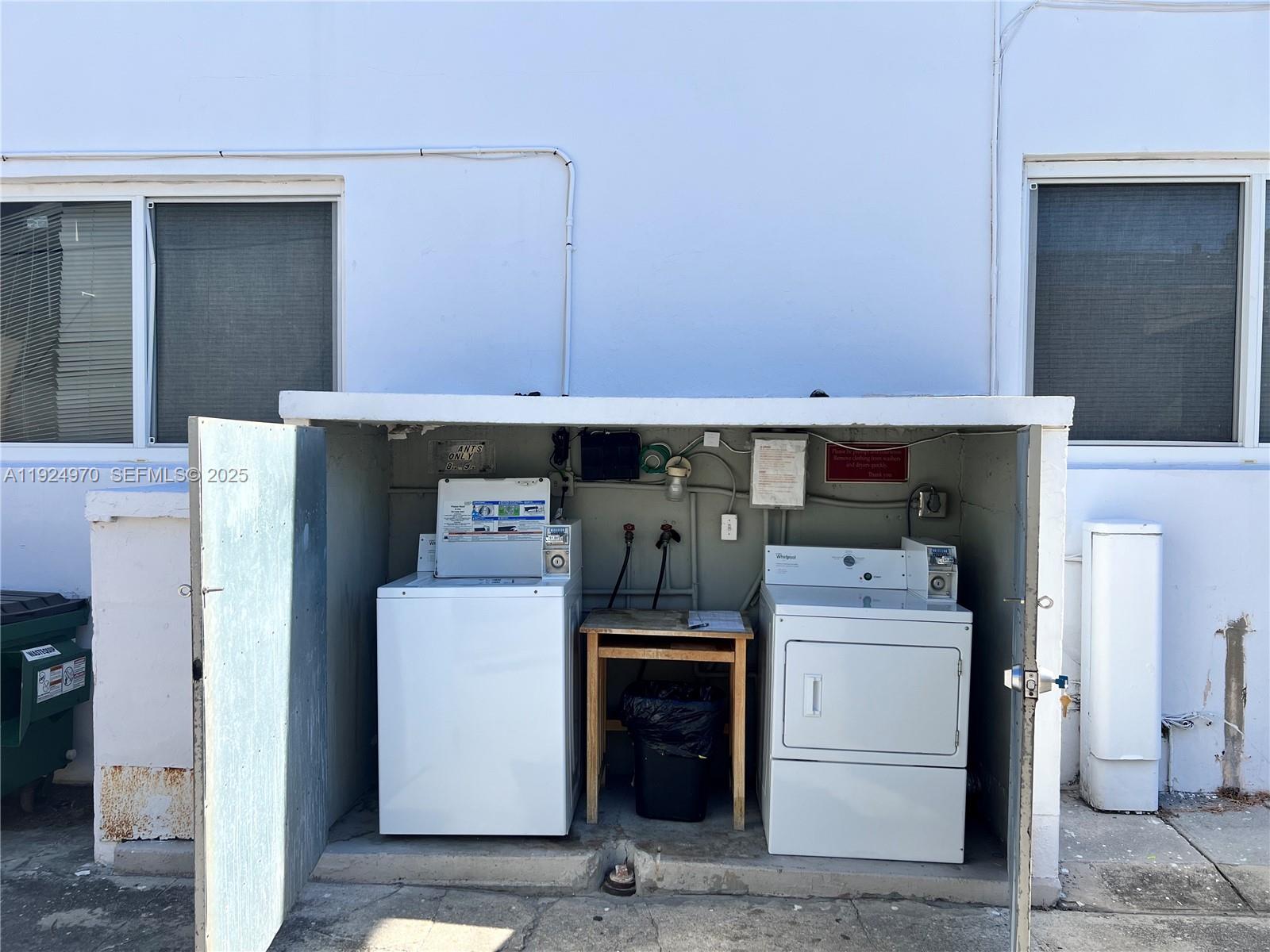7440 Byron Avenue, Unit 1B Miami Beach, FL 33141 - Photo 14 of 16 a utility room with dryer and washer