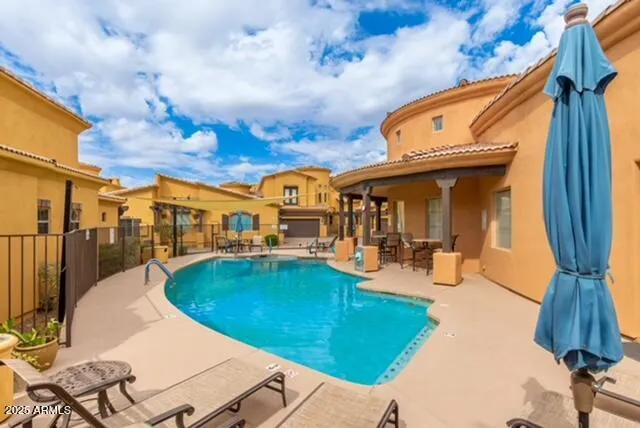 a view of a swimming pool with a patio