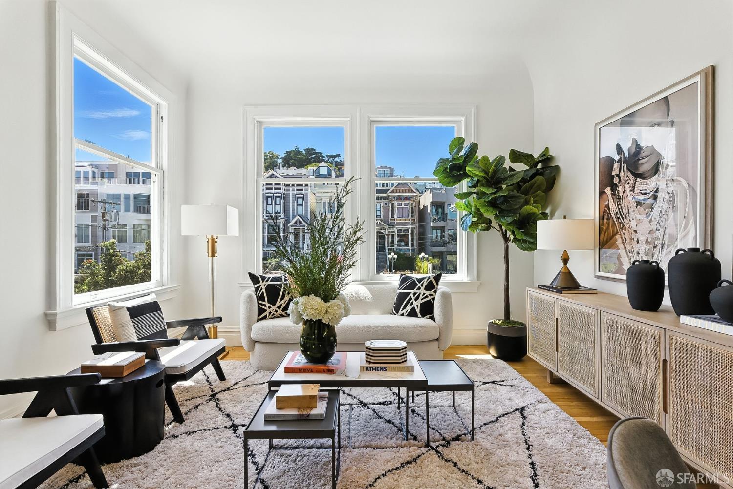 140 Divisadero Street, Unit 5 San Francisco, CA 94117 - Photo 1 of 32 a living room with furniture potted plant and a large window