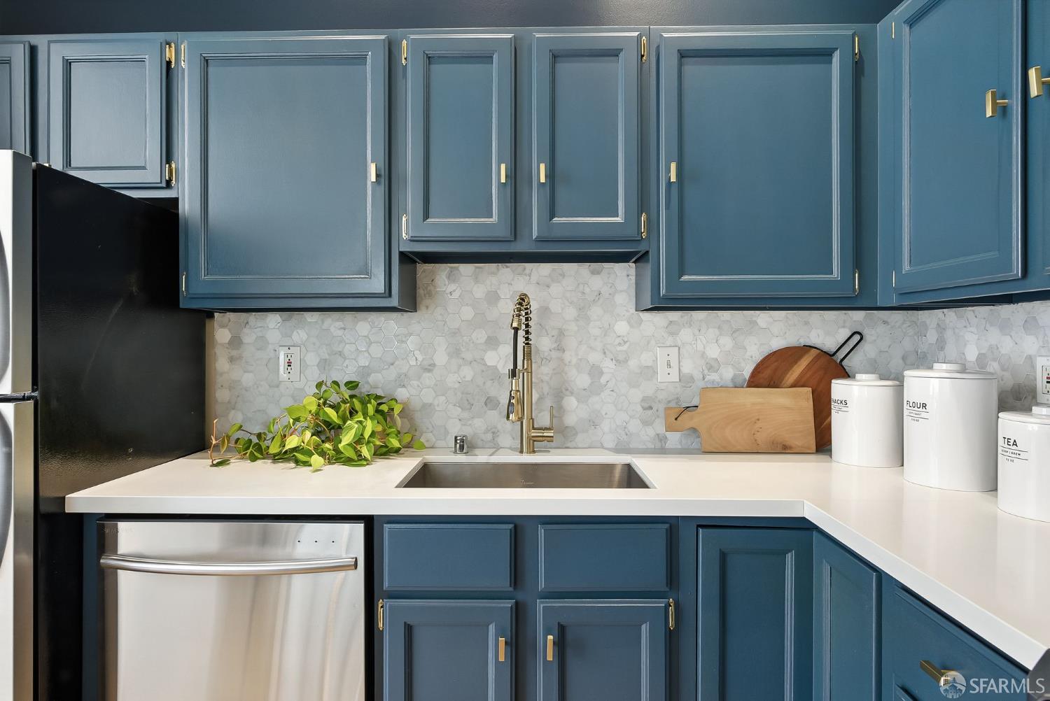 140 Divisadero Street, Unit 5 San Francisco, CA 94117 - Photo 15 of 32 a kitchen with stainless steel appliances granite countertop a sink stove and cabinets