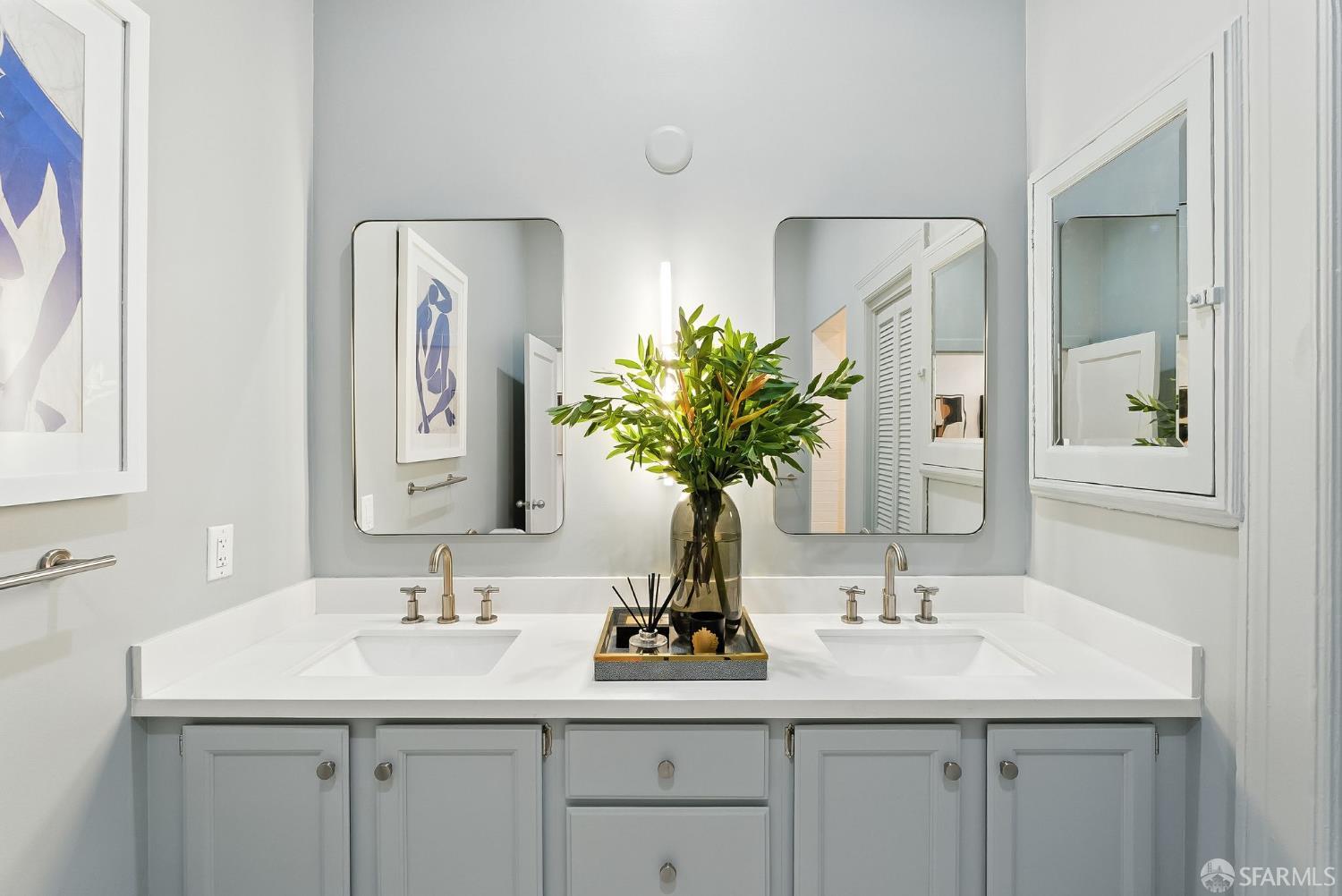 140 Divisadero Street, Unit 5 San Francisco, CA 94117 - Photo 16 of 32 a bathroom with a sink double vanity and a mirror