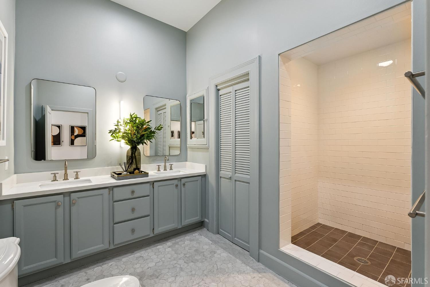 140 Divisadero Street, Unit 5 San Francisco, CA 94117 - Photo 17 of 32 a bathroom with a double vanity sink and mirror
