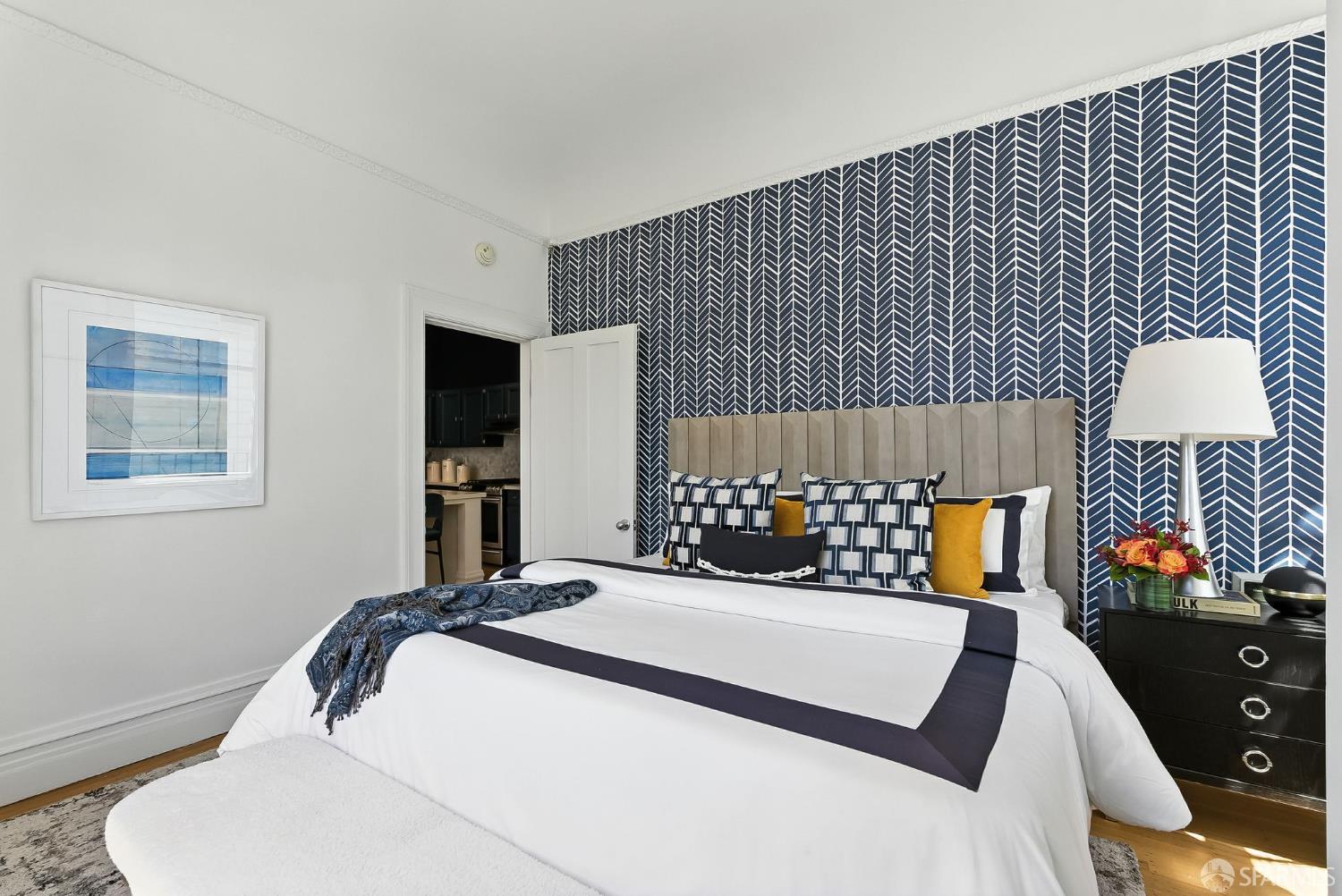 140 Divisadero Street, Unit 5 San Francisco, CA 94117 - Photo 18 of 32 a bedroom with bed and a night stand