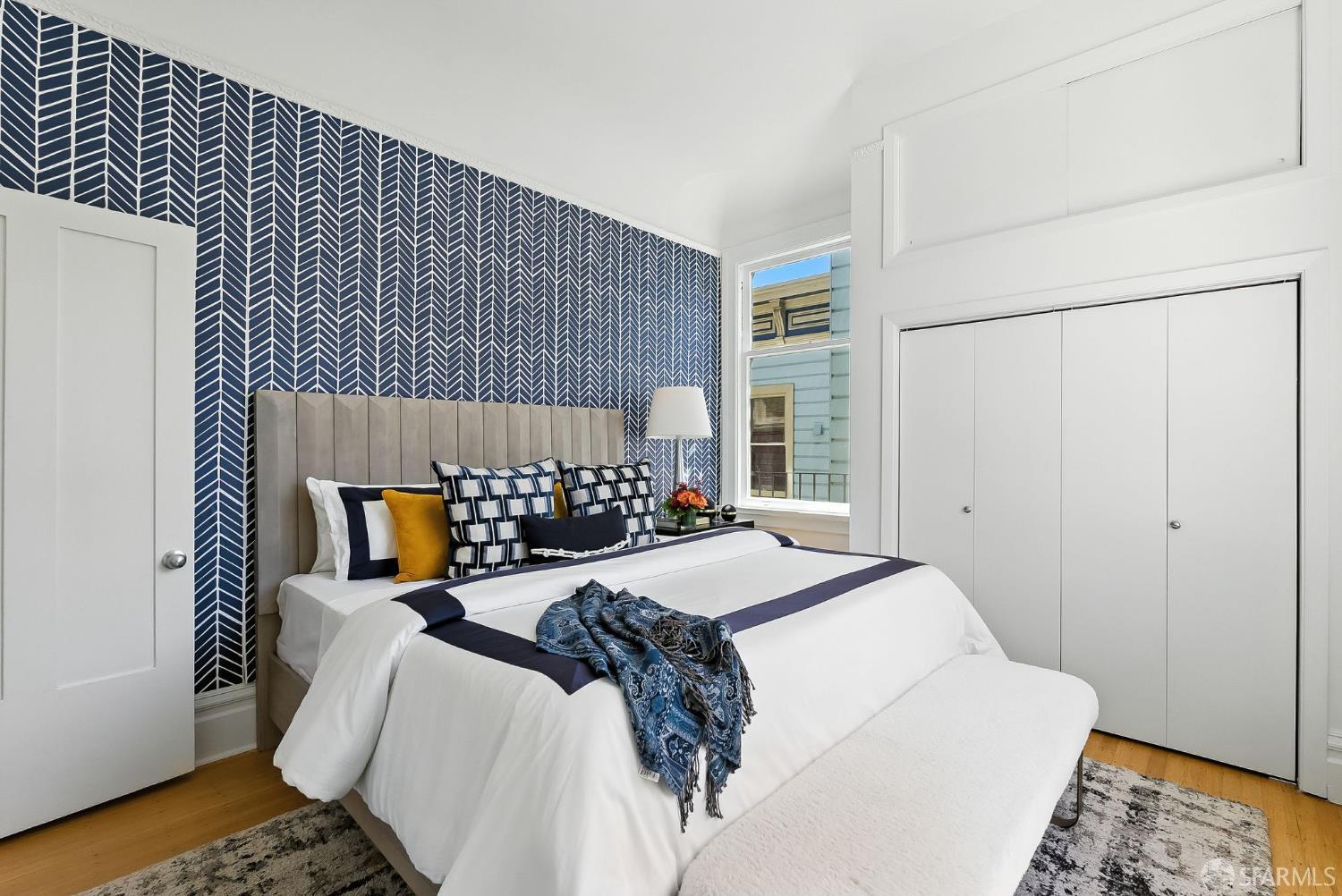 140 Divisadero Street, Unit 5 San Francisco, CA 94117 - Photo 19 of 32 a bed sitting in a bedroom and table