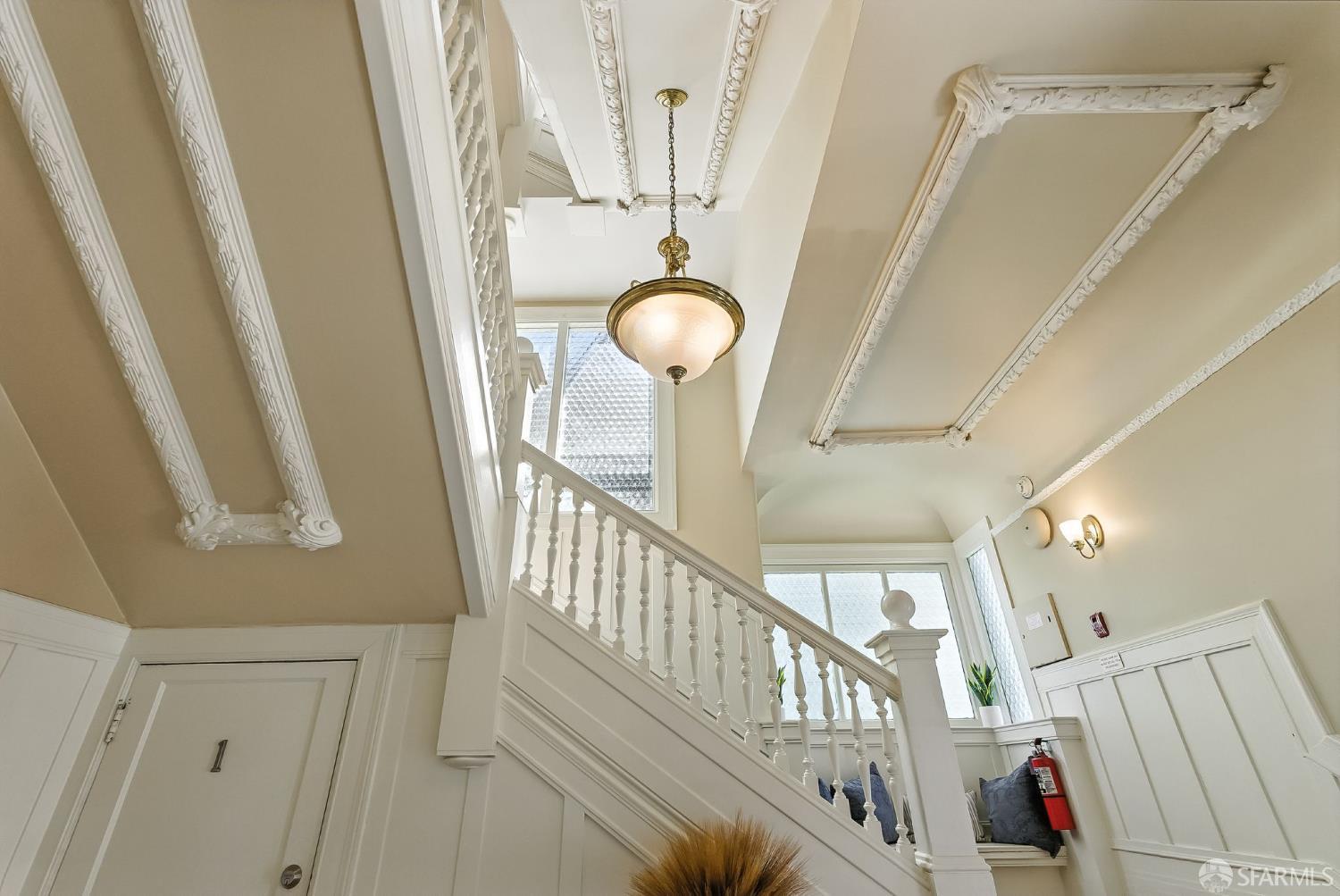 140 Divisadero Street, Unit 5 San Francisco, CA 94117 - Photo 25 of 32 a view of a hallway with wooden floor and windows