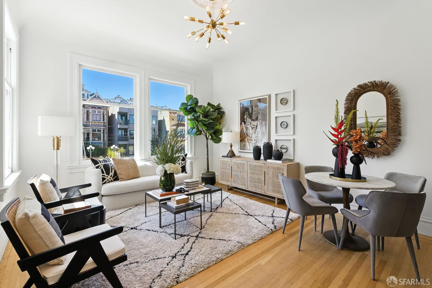 140 Divisadero Street, Unit 5 San Francisco, CA 94117 - Photo 3 of 32 a living room with furniture a dining table and a potted plant