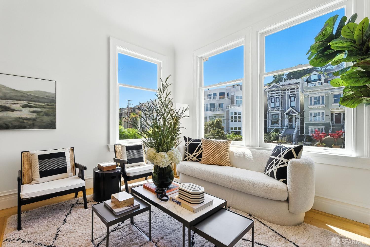 140 Divisadero Street, Unit 5 San Francisco, CA 94117 - Photo 4 of 32 a living room with furniture potted plant and a large window