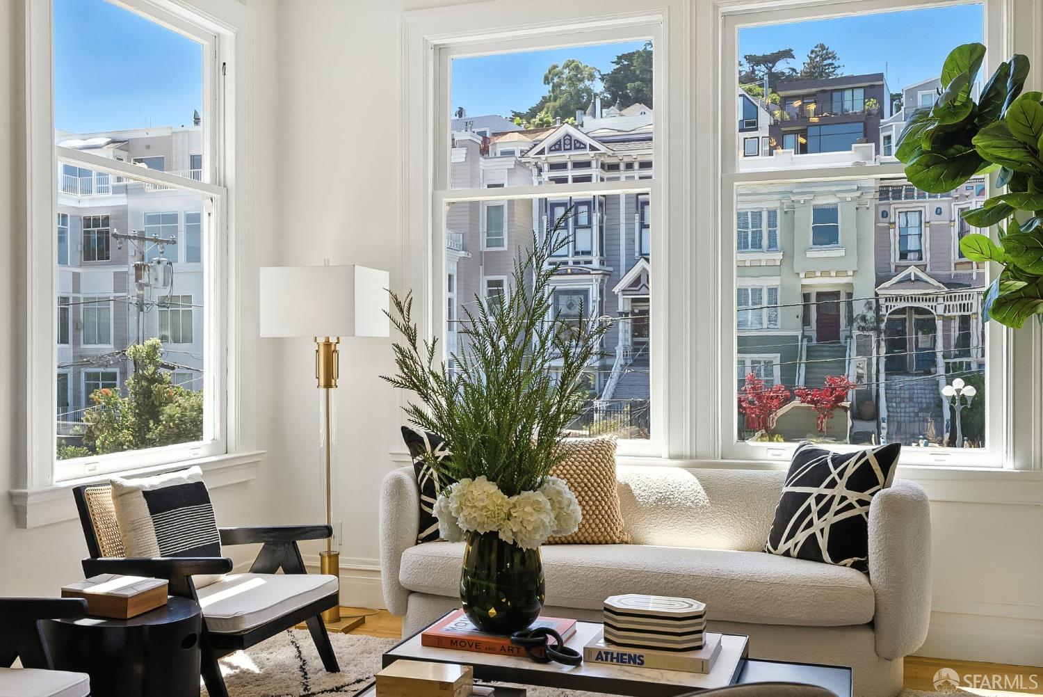 140 Divisadero Street, Unit 5 San Francisco, CA 94117 - Photo 5 of 32 a living room with furniture and a potted plant