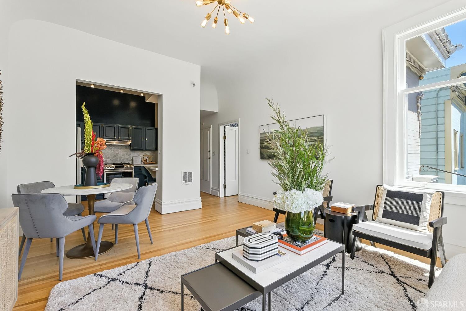 140 Divisadero Street, Unit 5 San Francisco, CA 94117 - Photo 8 of 32 a living room with furniture and a potted plant