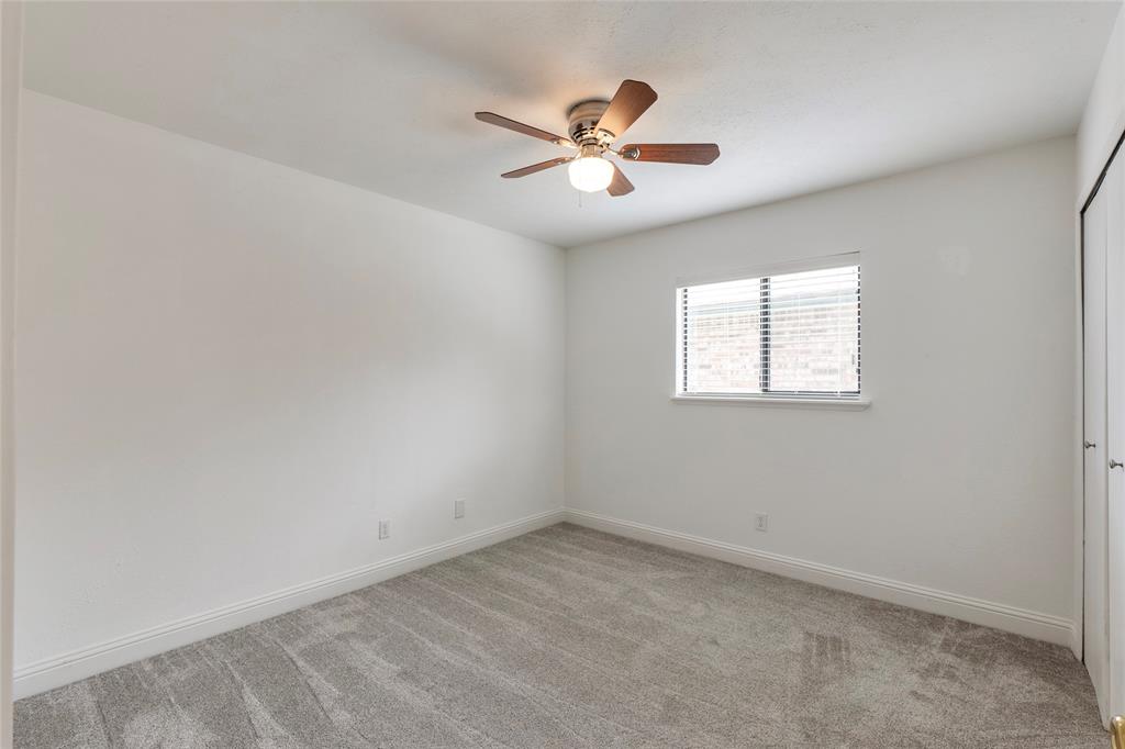 2004 White Ash Road Carrollton, TX 75007 - Photo 24 of 40 Bedroom #3 with ceiling fan and closet