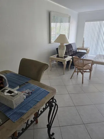 a view of a bathroom with a sink and a window
