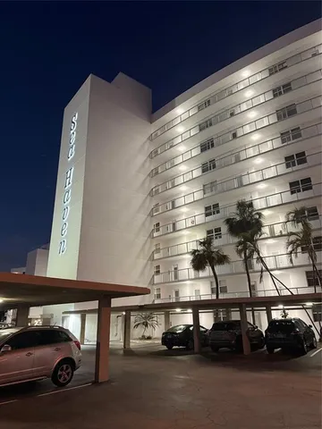 a view of a patio with a dining table and chairs
