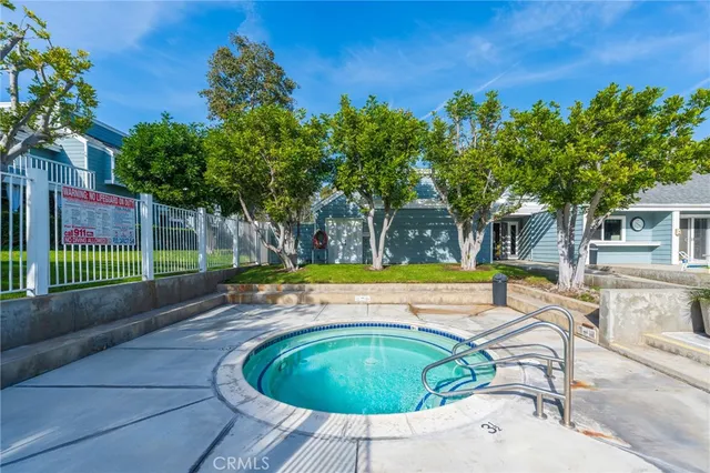 a view of a swimming pool with a lounge chairs