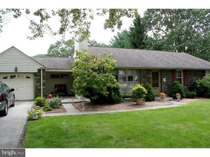 3410 Lewis Road Newtown Square, PA 19073 - Photo 1 of 23 a view of a patio with table and chairs potted plants and a large tree
