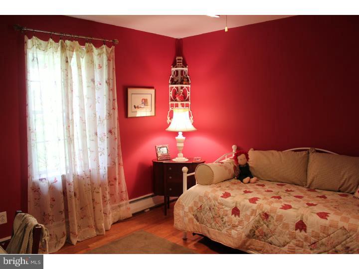 3410 Lewis Road Newtown Square, PA 19073 - Photo 11 of 23 a bedroom with a bed and a lamp