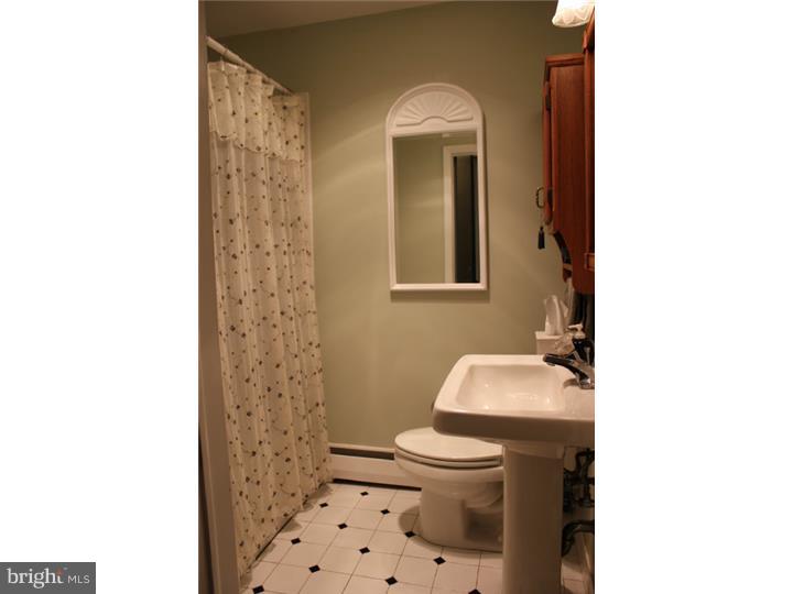 3410 Lewis Road Newtown Square, PA 19073 - Photo 12 of 23 a bathroom with a toilet and a sink