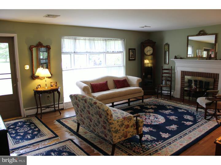 3410 Lewis Road Newtown Square, PA 19073 - Photo 6 of 23 a living room with furniture and a fireplace