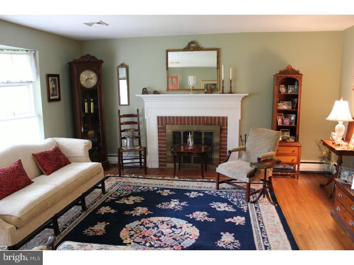 3410 Lewis Road Newtown Square, PA 19073 - Photo 7 of 23 a living room with furniture and a fireplace