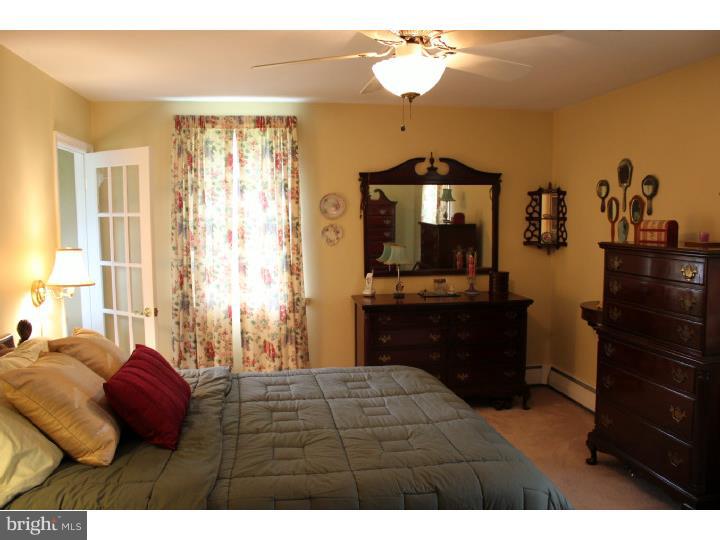 3410 Lewis Road Newtown Square, PA 19073 - Photo 8 of 23 a bedroom with a bed and a dresser