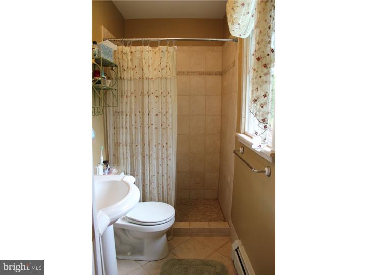 3410 Lewis Road Newtown Square, PA 19073 - Photo 9 of 23 a bathroom with a toilet and a shower