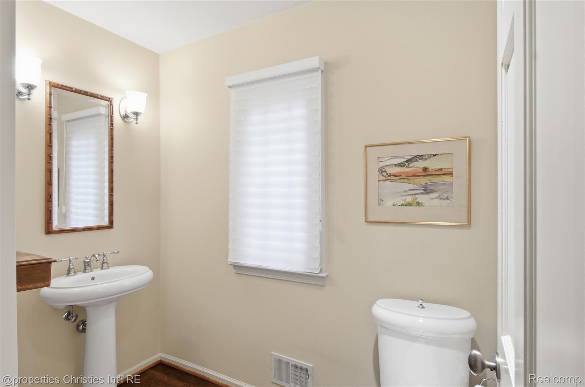 25235 Canterbury Road Franklin, MI 48025 - Photo 12 of 56 Powder room featuring a pedestal sink, wood-finish flooring, and a window with a cellular shade