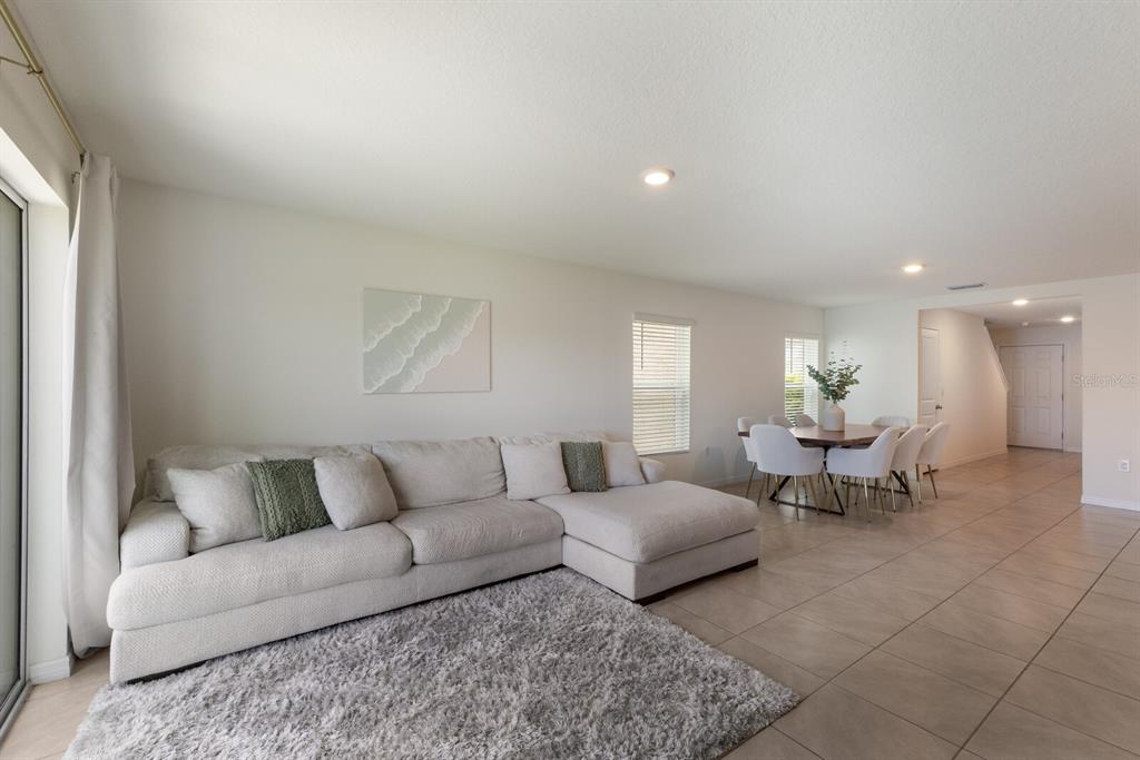 2938 Rock Sound Street Bradenton, FL 34208 - Photo 16 of 36 a living room with furniture and a couch