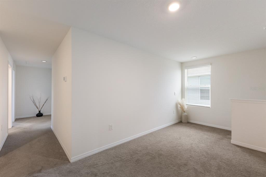 2938 Rock Sound Street Bradenton, FL 34208 - Photo 19 of 36 a view of an empty room with a window