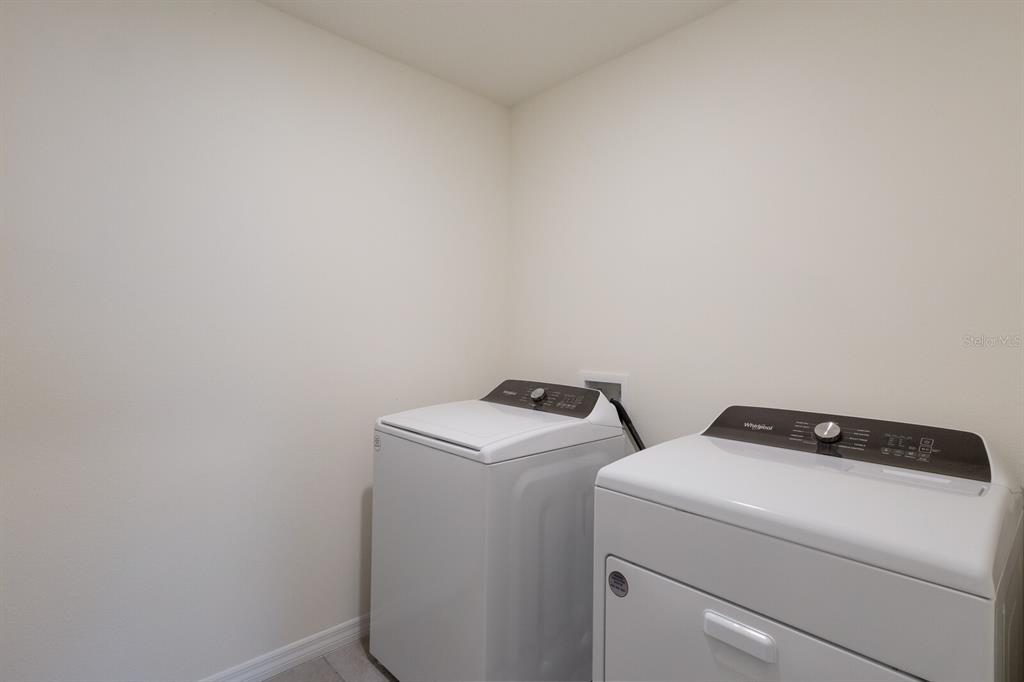 2938 Rock Sound Street Bradenton, FL 34208 - Photo 20 of 36 a utility room with dryer and washer