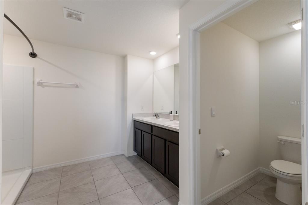 2938 Rock Sound Street Bradenton, FL 34208 - Photo 23 of 36 a view of bathroom with a sink and toilet