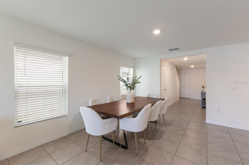 2938 Rock Sound Street Bradenton, FL 34208 - Photo 8 of 36 a dining room with furniture and window