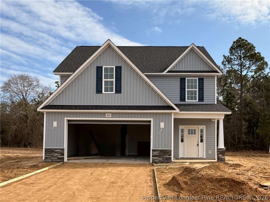 360 Sacksonia Street Raeford, NC 28376 - Photo 1 of 18 a front view of a house with a garage