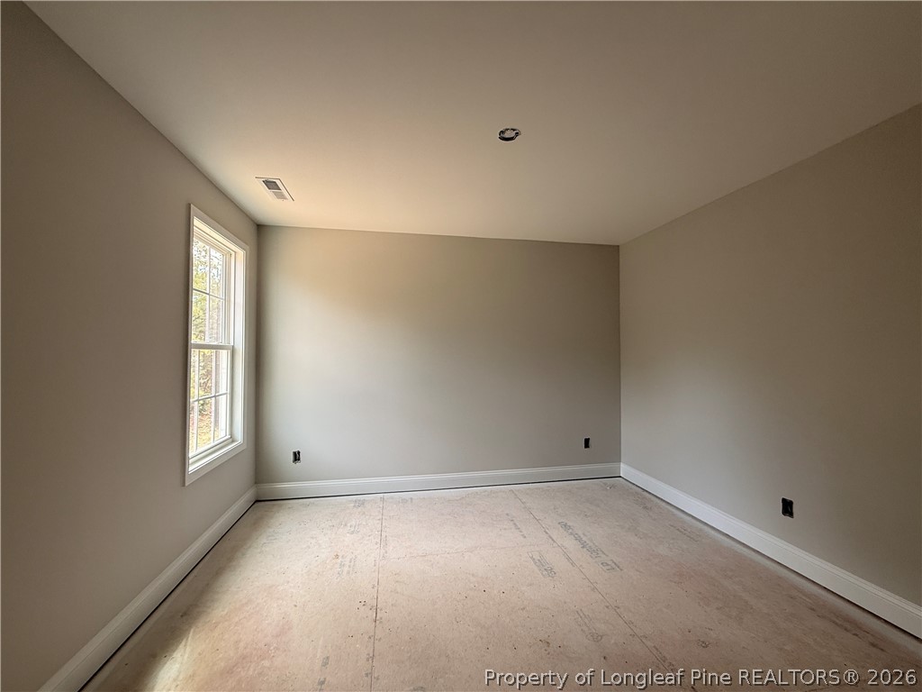 360 Sacksonia Street Raeford, NC 28376 - Photo 14 of 18 an empty room with windows