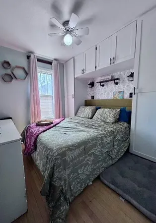 a bed room with a bed and a television