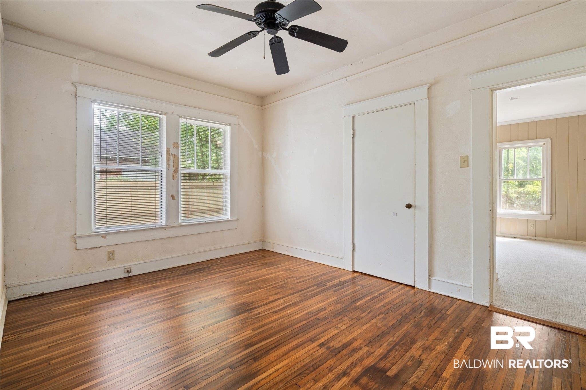 121 Westwood Street Mobile, AL 36606 - Photo 15 of 20 Unfurnished room with wood-type flooring, a wealth of natural light, and ceiling fan