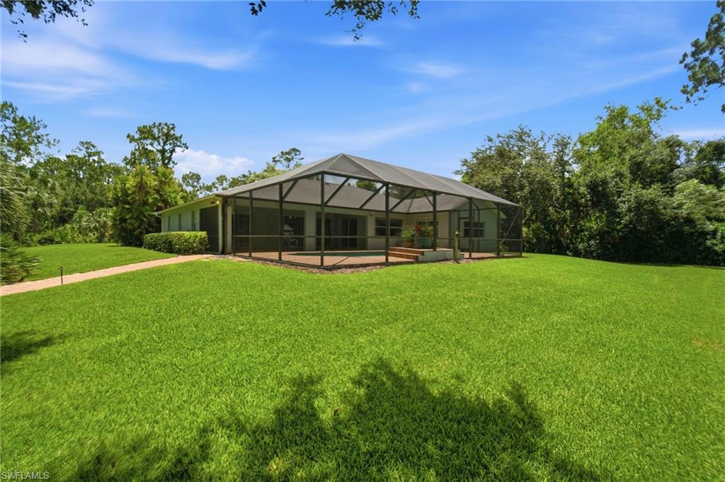 2053 17th Street Southwest Naples, FL 34117 - Photo 23 of 47 a view of a house with a big yard