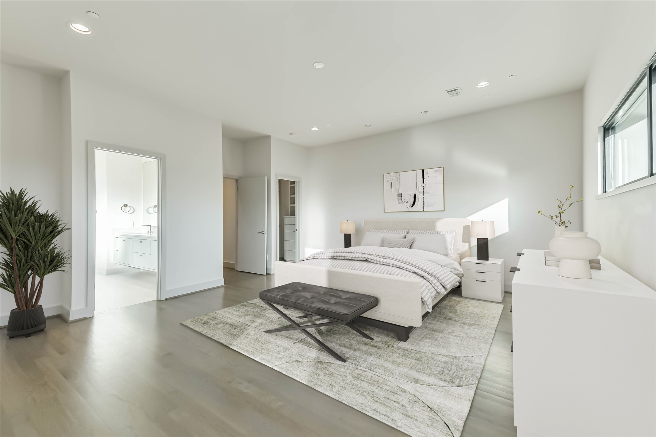 1509 Ruth Street Houston, TX 77004 - Photo 13 of 33 The primary suite is spacious enough for a sitting area in addition to your king sized bed and night stands. Views overlook the city, hard wood floors, access to the ensuite bathroom and 2 closets round out the features of the owner's retreat. Virtually staged.