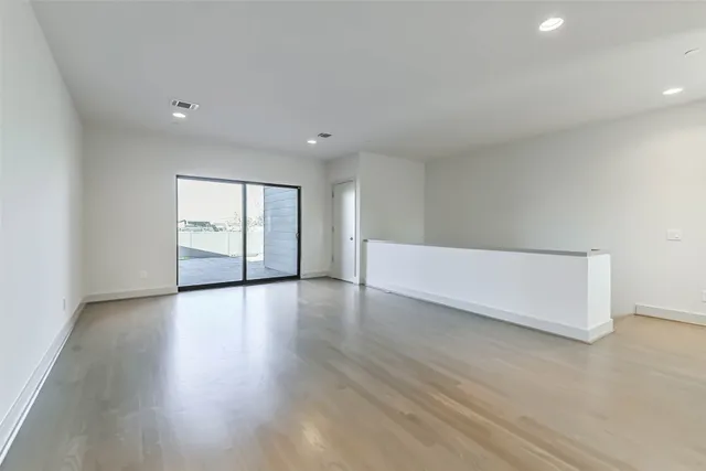 a bathroom with a granite countertop sink a toilet and a bathtub