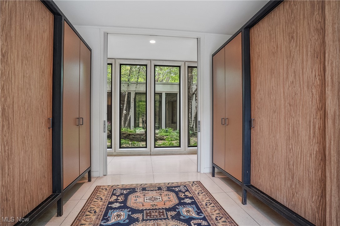 3210 North Dover Road Stow, OH 44224 - Photo 2 of 44 Doorway to outside featuring light tile patterned floors