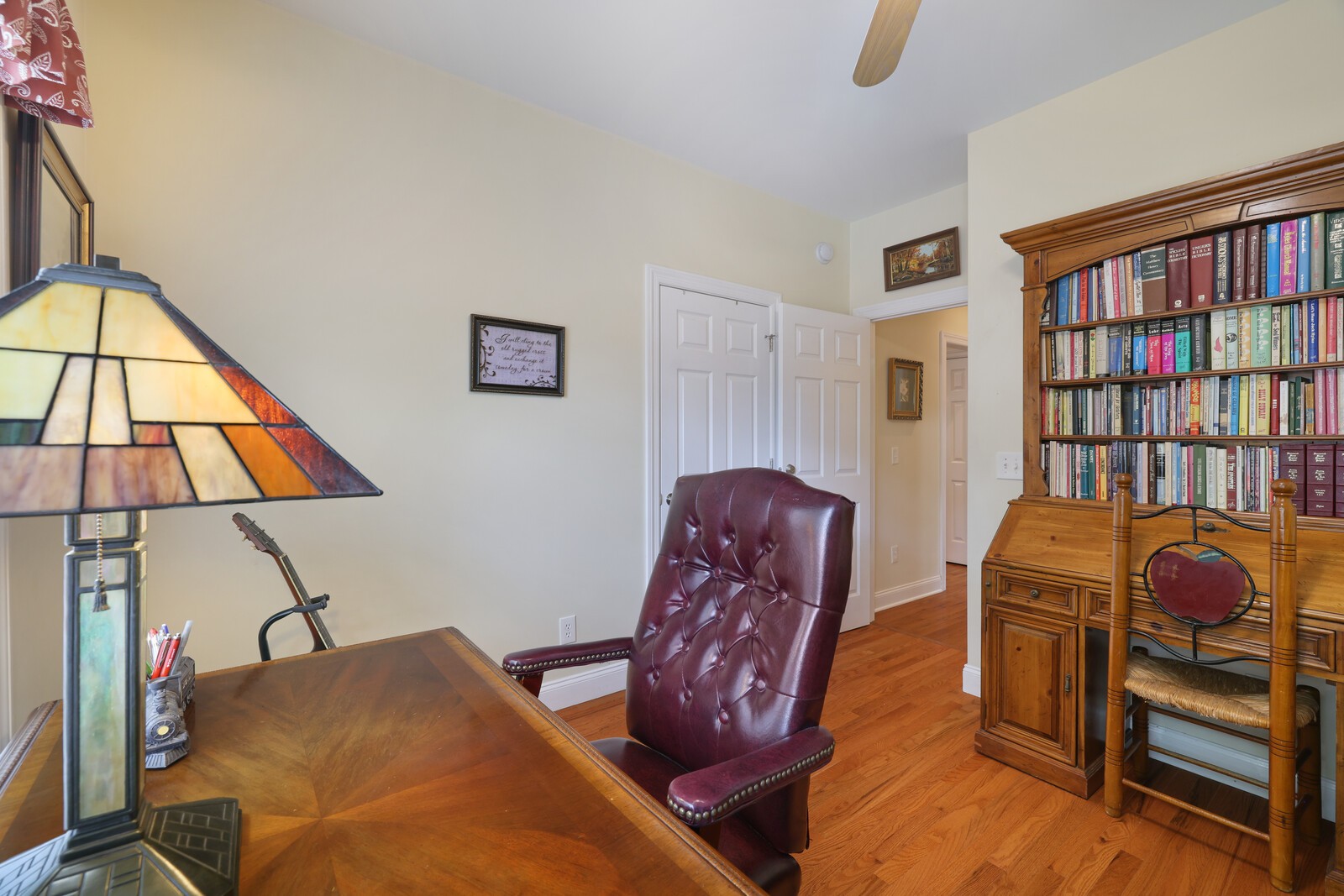 3020 Brookside Path Murfreesboro, TN 37128 - Photo 33 of 59 a living room with furniture a book shelf and a book shelf