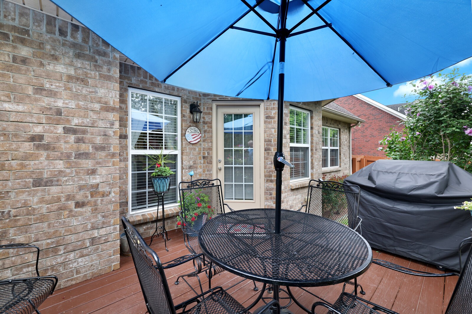 3020 Brookside Path Murfreesboro, TN 37128 - Photo 46 of 59 a patio with a table and chairs under an umbrella