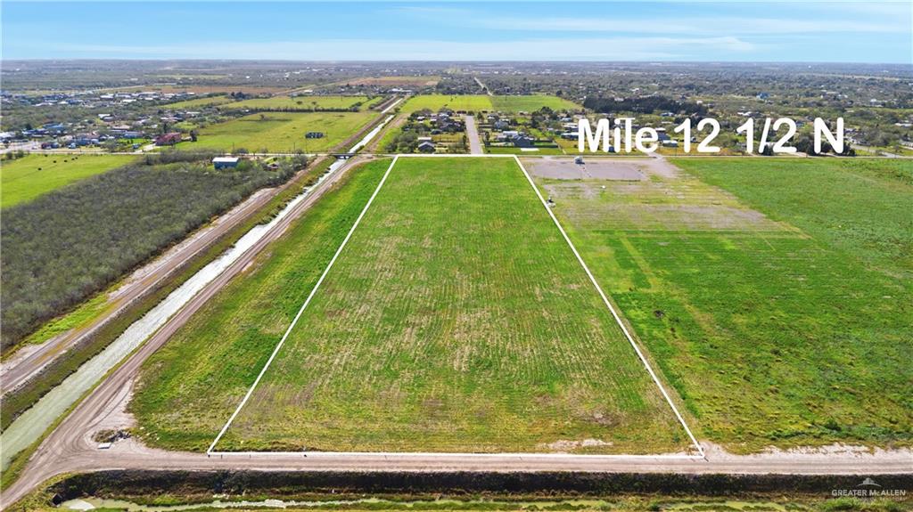 4181 Mile 12 1/2 N Road Weslaco, TX 78599 - Photo 3 of 14 a view of swimming pool with a garden