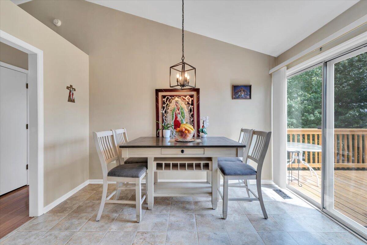 4751 Westvale Road Northeast Roanoke, VA 24019 - Photo 12 of 30 a view of a dining room with furniture window and wooden floor