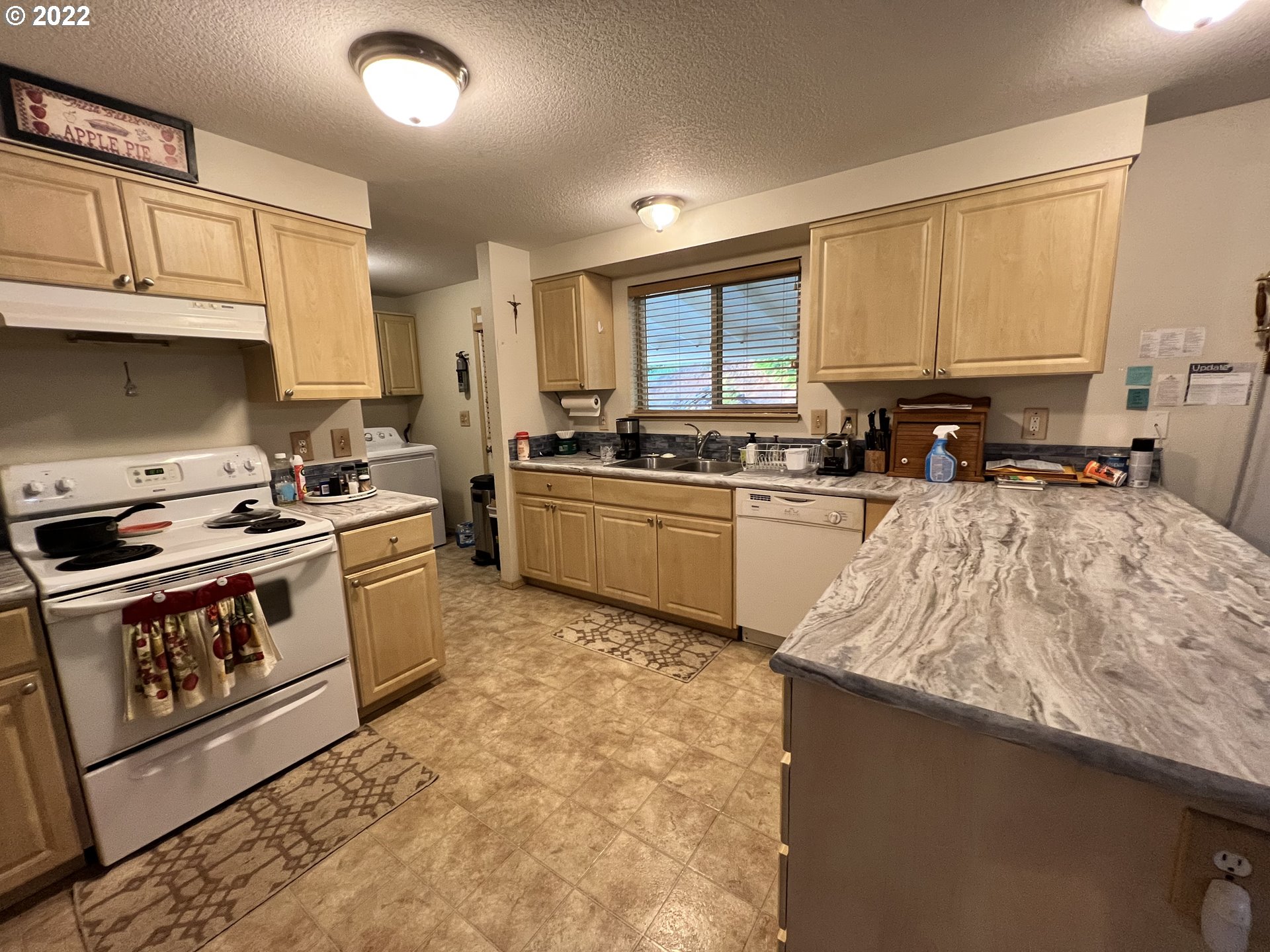 42425 Southwest Fort Hill Road Willamina, OR 97396 - Photo 8 of 31 a kitchen with stainless steel appliances granite countertop a stove a sink and a microwave